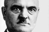 Porträt von Christian Wirth (1885-1944), Kriminalkommissar Polizeipräsidium Stuttgart, Aufbau der Büroabteilung in Grafeneck, Leiter der Büroabteilung in Hartheim bei Linz, Kommandant des Vernichtungslagers Belzec und Generalinspekteur der "Aktion Reinhard". Das Bild zeigt einen Mann mit ernstem Blick, dunklem Schnauzbart, dunklen Augen und mit Glatze. Bildnachweis: Hauptstaatsarchiv Stuttgart Porträt von Christian Wirth (1885-1944), Kriminalkommissar Polizeipräsidium Stuttgart, Aufbau der Büroabteilung in Grafeneck, Leiter der Büroabteilung in Hartheim bei Linz, Kommandant des Vernichtungslagers Belzec und Generalinspekteur der "Aktion Reinhard". Das Bild zeigt einen Mann mit ernstem Blick, dunklem Schnauzbart, dunklen Augen und mit Glatze.